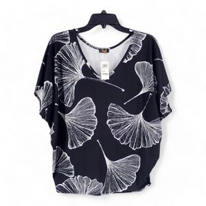 Luz Women's Blouse Black and White Size Small Top Stretch Tunic Sea Shell Fan